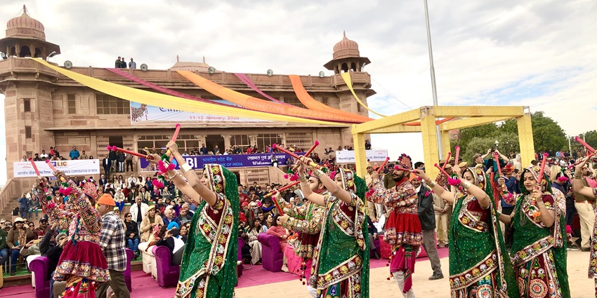 An image showing the Bikaner Camel Festival with decorated camels and cultural performances.