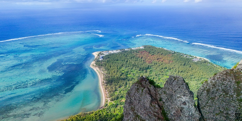 Blue Bay Marine Park, with crystal-clear waters and coral reefs visible from the surface.