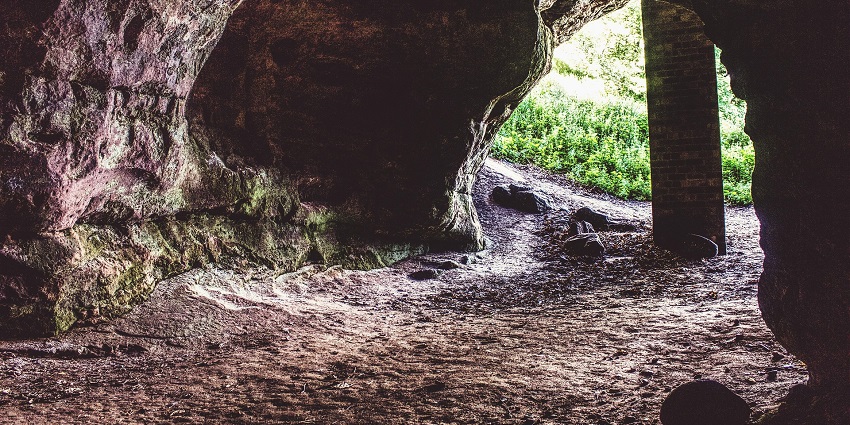 An image showing a cave with a tunnel and rock formations, similar to Bo Nau Cave.