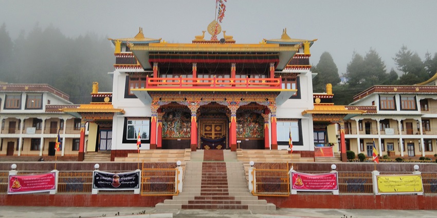 A panoramic view of a majestic monastery in Bomdila adorned with vibrant colours.