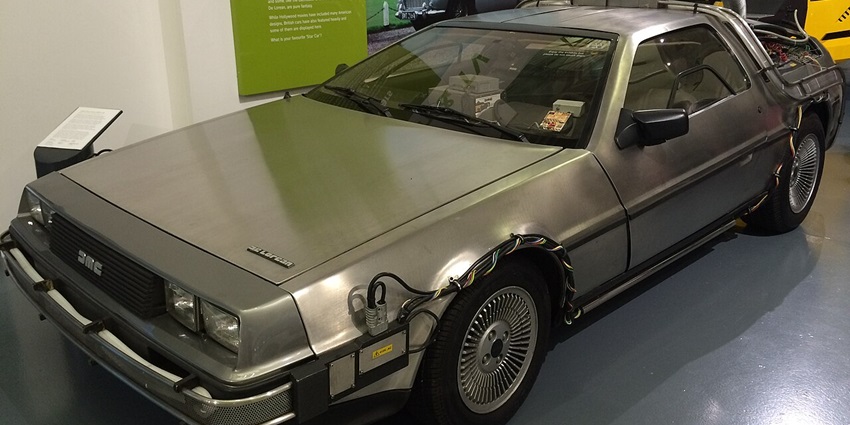 An image showing a 1981 DeLorean DMC-12 on display at the British Motor Museum, UK.