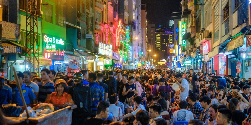 An image showing the night view of Bui Vien Street, one of the famous places to visit in Ho Chi Minh
