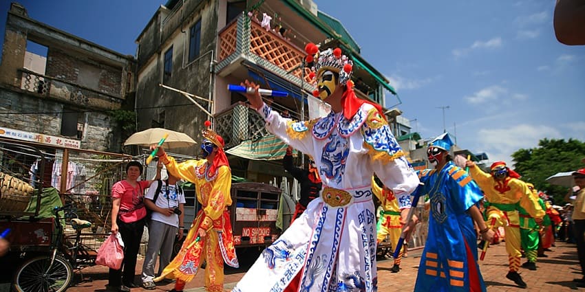 A colorful celebration in Cheung Chau featuring parades and traditional rituals
