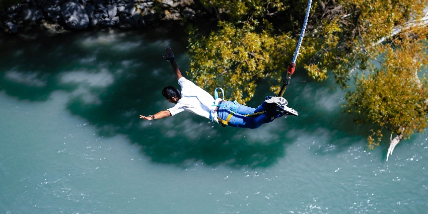A tourist enjoying bungee jumping, one of the thrilling adventure sports in Goa