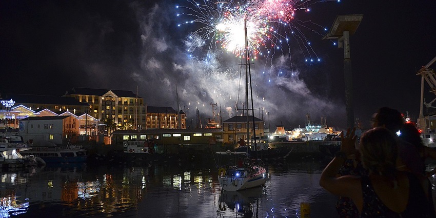 A nighttime view of Cape Town in South Africa adorned with firecrackers and lights.