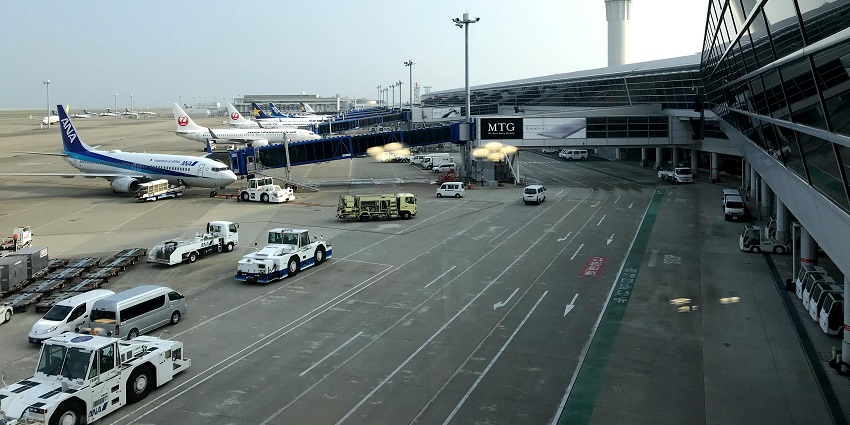 An aircraft with many other vehicles parked in the Maldonado airport in Uruguay