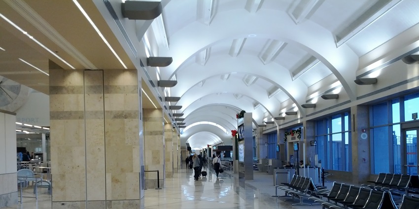 Passengers walking through the airport terminal at one of the major airports in Bolivia.