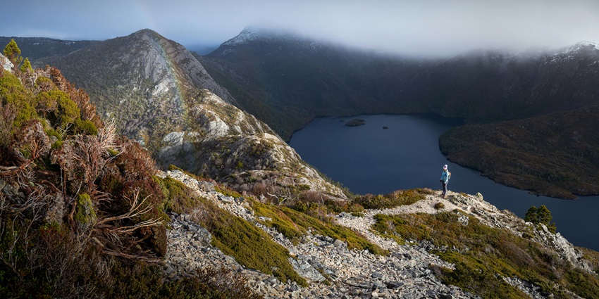 A photographer capturing the breathtaking scenery of Cradle Mountain.