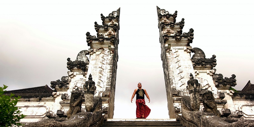 Image of a man standing between the Handara gate, one of the most photogenic spot