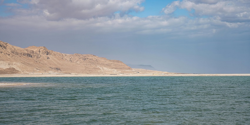 An image of the Caspian Sea coastline with clear blue waters and scenic surroundings