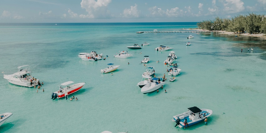 Cayman Islands, known for Seven Mile Beach offers upscale resorts and clear waters.