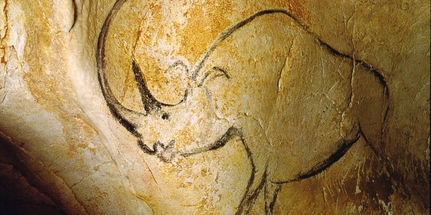 Find the most ancient wall art engraved on the walls of this well-known prehistoric cave