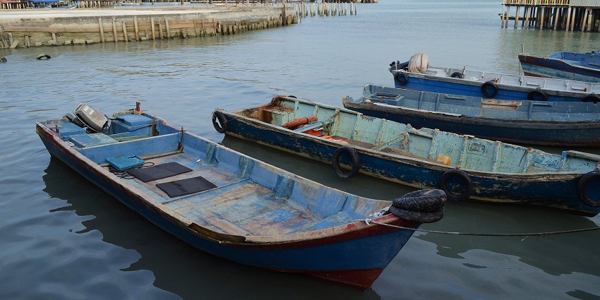 Boats parked at Chew Jetty, a spot for witnessing the best sunsets near Gurney Plaza.