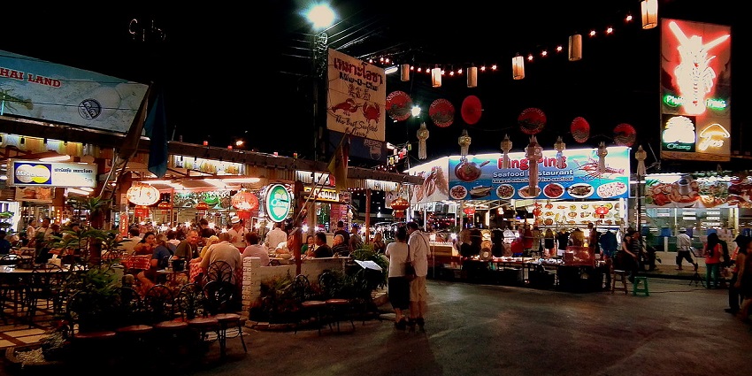 Chiang Mai Night Bazaar, a popular destination near Chiang Mai, with stalls and lights.