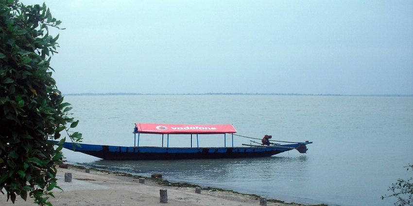 Aerial view of Chilika Lake, one of the lakes in Nagaland, showcasing vast blue waters and small islands in the distance.
