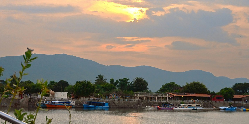 An image of the mouth of Chilika Lake, a lake in Odisha, where calm waters meet the sea.