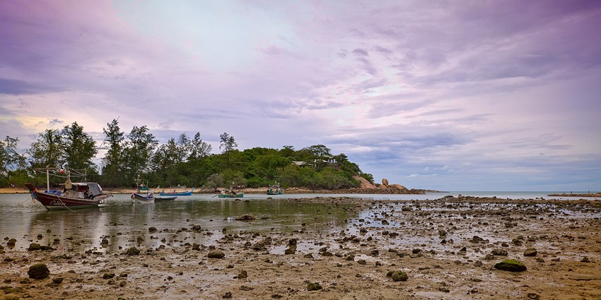 A charming beach with soft sand, clear water, and a laid-back atmosphere perfect for relaxation.