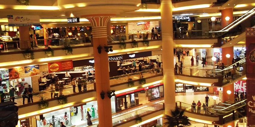 Bustling view of Citystars Mall interior with shoppers, bright stores, and a lively atmosphere