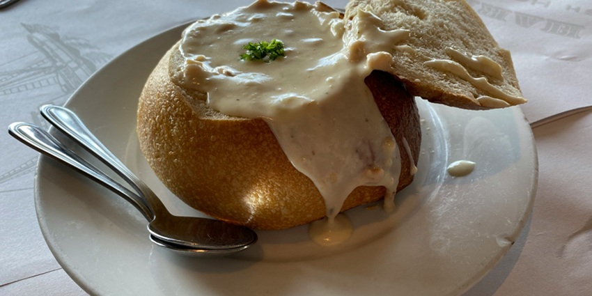 An image of a bowl of clam chowder, a seafood classic and famous food in the USA.