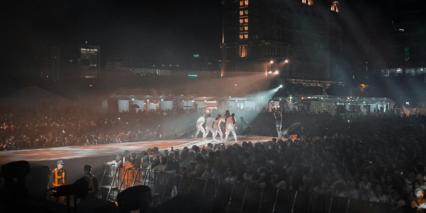 An image of diverse crowds enjoying live performances at Clockenflap in Hong Kong.