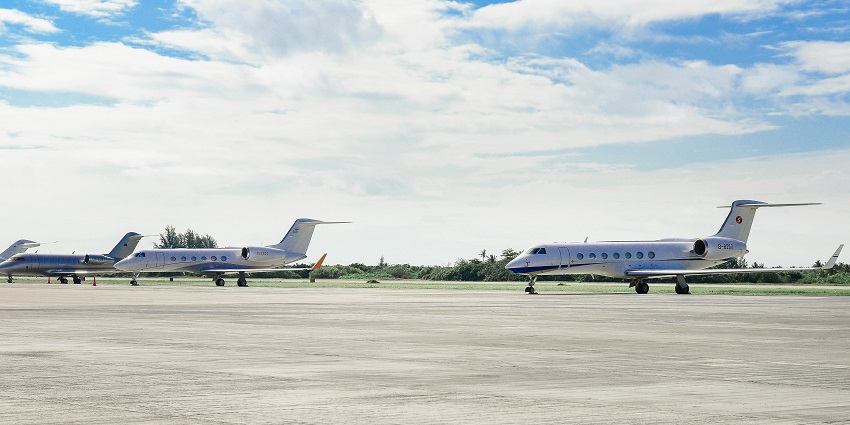 Two planes parked in a terminal at one of the airports in Dominican Republic.