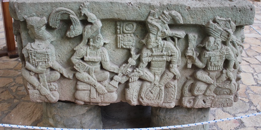 Altar Q at Copán Museum, depicting dynastic rulers in a detailed Mayan stone sculpture.