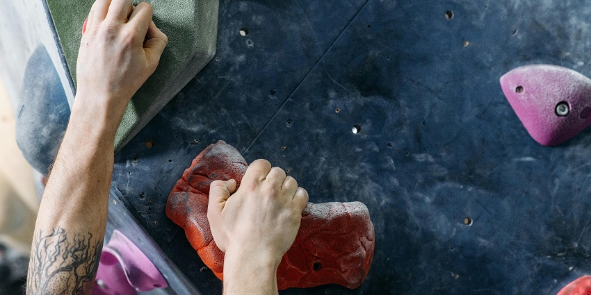 An image resembling a rock climber in Crag Studio, one of India's rock climbing places.