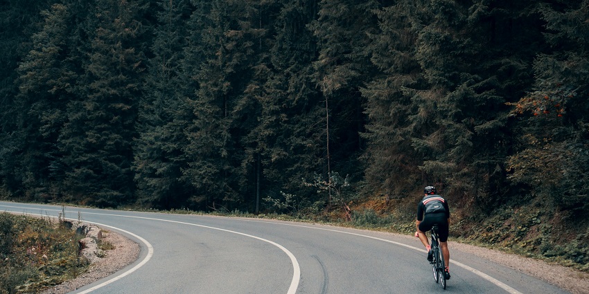 A glimpse of a person enjoying cycling on the perfectly manicured lawns of Lake Gregory.