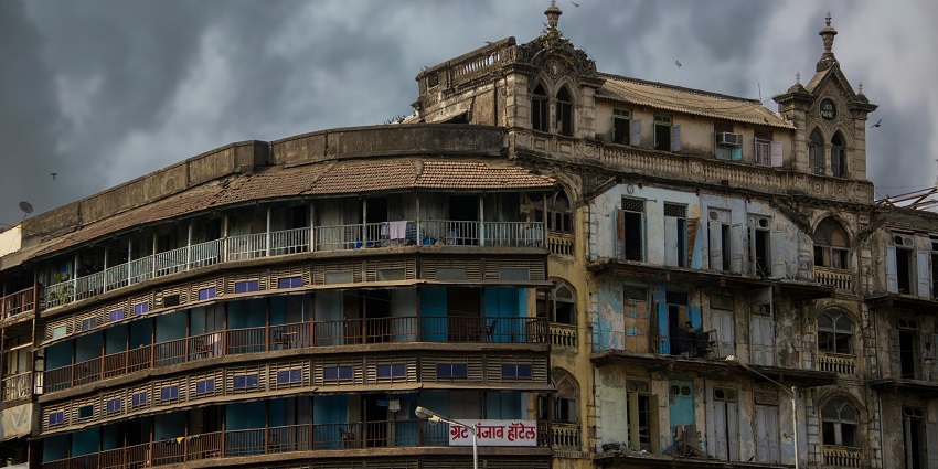 An image of D'Souza Chawl, Mumbai, Maharashtra, with old residential buildings and narrow alleys.