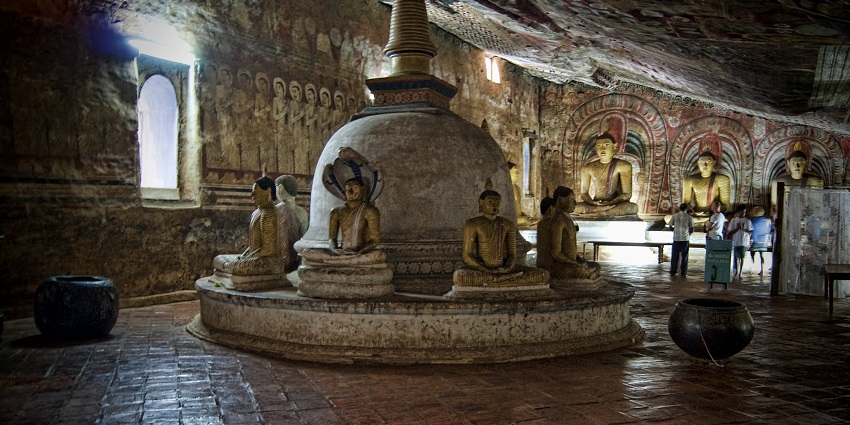 Marvel at Dambulla's ancient artistry as buddhist caves display sacred mural wonders.