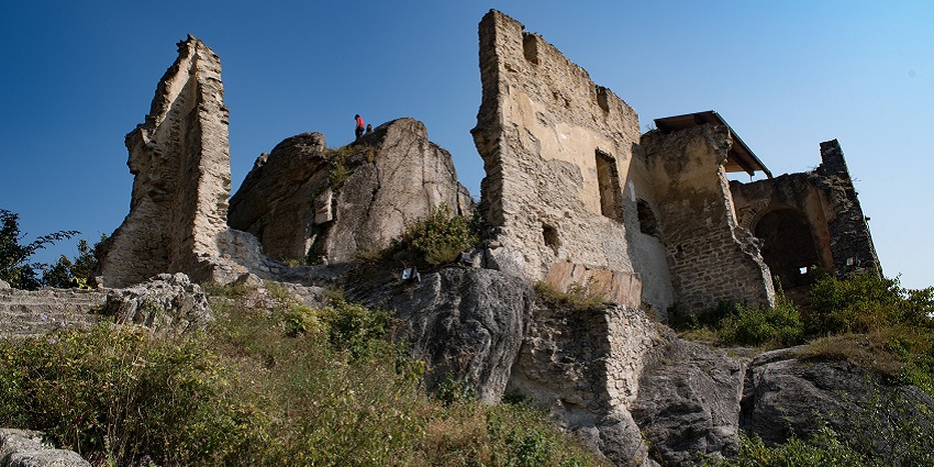 An image showing ancient ruins with signs of disintegration, similar to the Dao Dua Relic Site.