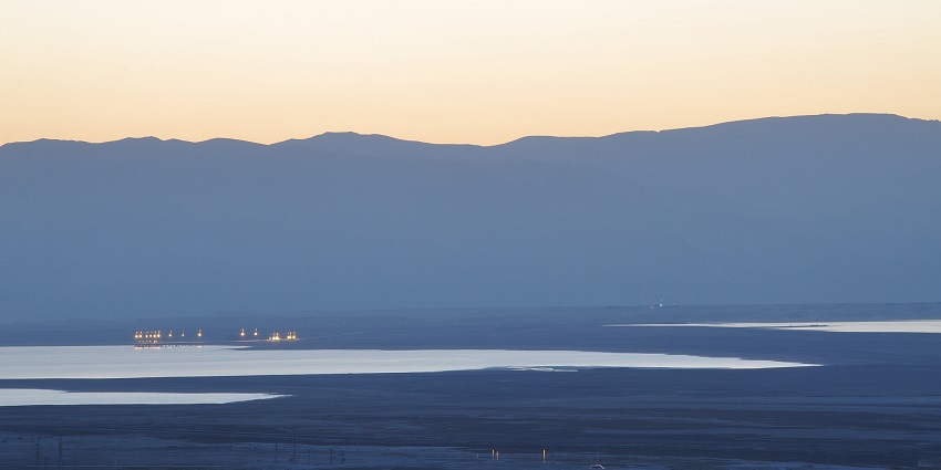 Wide angle view of the Dead sea at dust with the sunset sky in the background