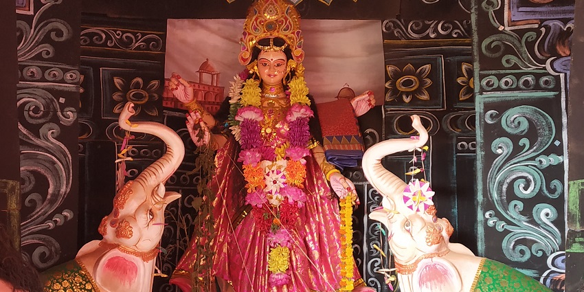 An image showing Laxmi Puja being performed as an important custom during Dhanteras.
