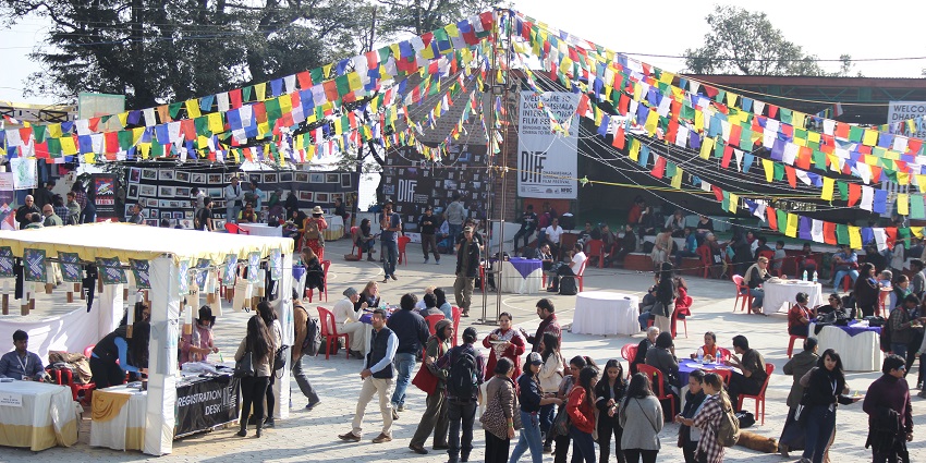 An image of the DIFF, one of the famous short film festivals in India, with colourful flags.