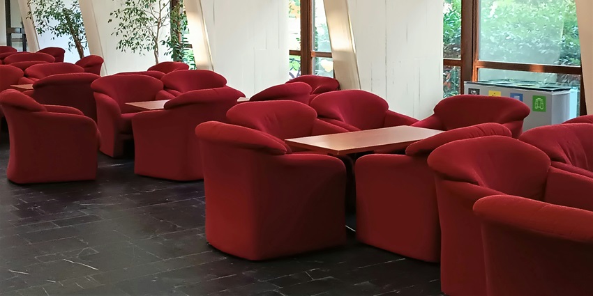 A lounge with chairs, aesthetic sitting, and dine in system at the only airport in Berlin.