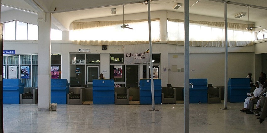 Booking counter at Dire Dawa Aba Tenna Dejazmach Yilma Airport with few passengers