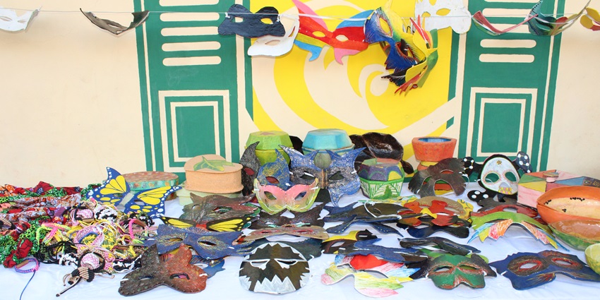 An image of colourful mosaic murals adorning the streets of Jacmel, Haiti’s artistic hub.