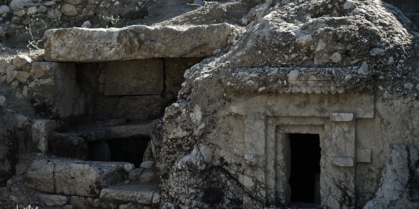 An image of Lycian tombs in Tlos, Turkey, carved into cliffs, showcasing Things To Do in Fethiye.