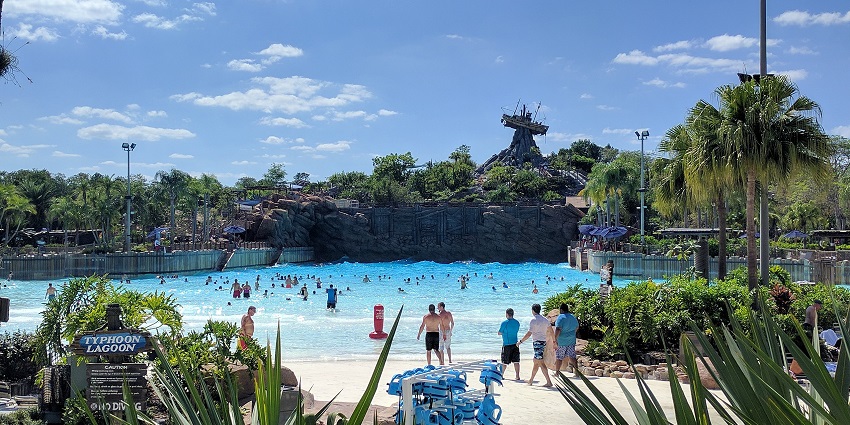 An image showing the Surf-Wave Pool at Typhoon Lagoon with waves and visitors in the water
