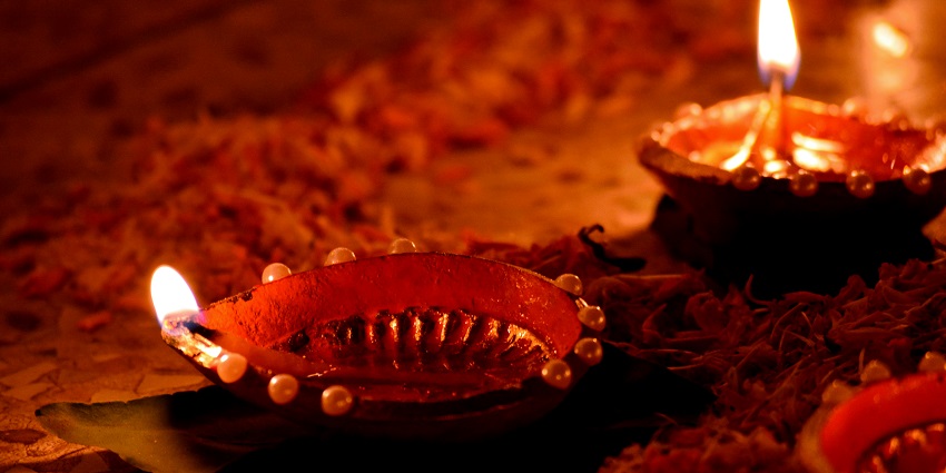 A beautiful view of the diyas lighted all around during a festival in autumn season.