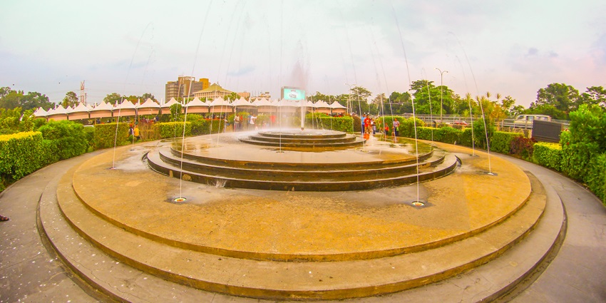A calm view of Diyatha Uyana with gardens and walking paths during the daytime.