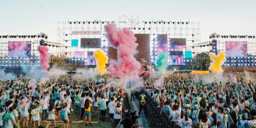 An image of a massive crowd and dazzling lights at the Djakarta Warehouse Project in Indonesia.