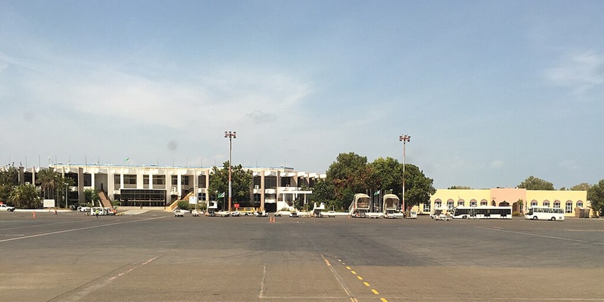 Djibouti Ambouli International Airport from above with airport buildings and a long runway.