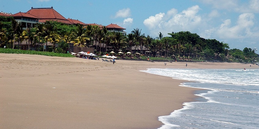 Relax on soft sands and watch breathtaking views at Double Six Beach, Seminyak, Bali.