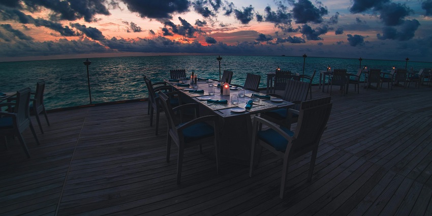 View of a beach side bench at sunset, at the Drifters Bar & Entertainment Venue.