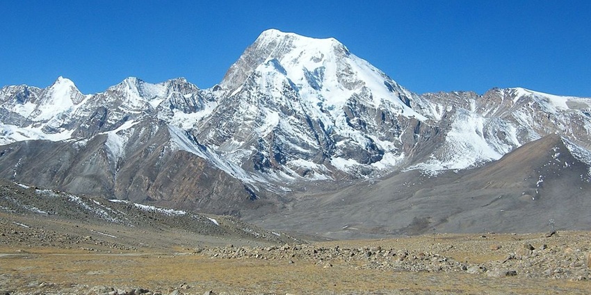 Cold desert in northern Sikkim with mountain peaks covered in snow and sandy plains