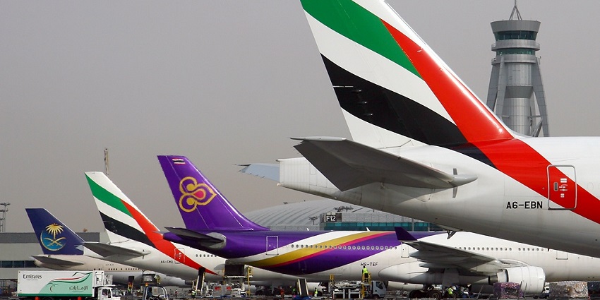 Aircraft from different airlines are parked at Concourse 3 of Dubai International Airport
