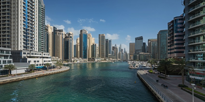 Dubai Marina skyline with luxury yachts, a vibrant hub for parasailing in Dubai adventures