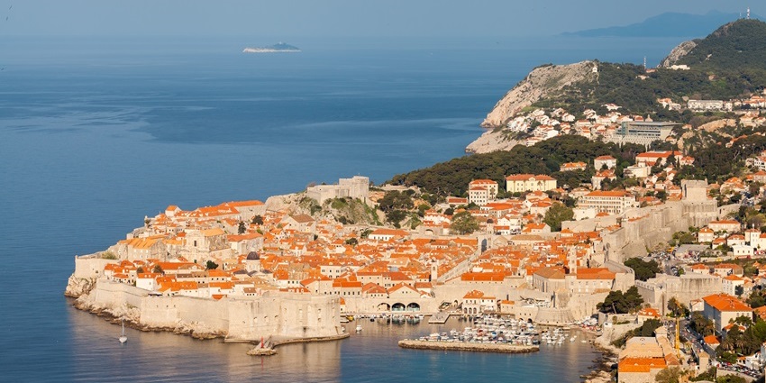 An image with the early morning view of the Old Town of Dubrovnik and its city walls