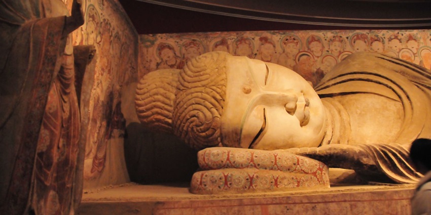 A magnificent and mesmerising Buddha statue at Dunhuang Mogao Caves Museum, China.